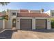 Two-car garage and front entrance of the home at 2524 S El Paradiso -- # 76, Mesa, AZ 85202