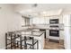 Modern kitchen featuring white cabinets and breakfast bar at 2524 S El Paradiso -- # 76, Mesa, AZ 85202