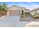 One-story home with a two-car garage and desert landscaping at 26171 W Via Del Sol Dr, Buckeye, AZ 85396