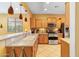 Well-lit kitchen featuring stainless steel appliances and light wood cabinets at 26171 W Via Del Sol Dr, Buckeye, AZ 85396