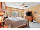 Bright main bedroom with large window and wood furniture at 26171 W Via Del Sol Dr, Buckeye, AZ 85396