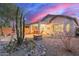 Backyard with patio, fire pit and desert landscaping at 26222 W Behrend Dr, Buckeye, AZ 85396