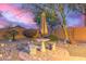 Landscaped backyard with patio furniture and seating at 26222 W Behrend Dr, Buckeye, AZ 85396