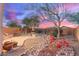 Landscaped backyard with seating and desert plants at 26222 W Behrend Dr, Buckeye, AZ 85396