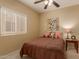 Bright bedroom with a double bed and decorative accents at 26222 W Behrend Dr, Buckeye, AZ 85396