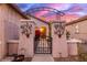 Elegant entry gate with decorative metalwork and arched design at 26222 W Behrend Dr, Buckeye, AZ 85396