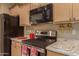 Close-up of kitchen's stainless steel range and microwave at 26222 W Behrend Dr, Buckeye, AZ 85396