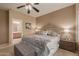 Main bedroom with king-size bed and en-suite bathroom access at 26222 W Behrend Dr, Buckeye, AZ 85396