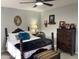 Cozy bedroom featuring antique furniture and ceiling fan at 2705 S Copperwood --, Mesa, AZ 85209