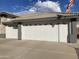 Three-car garage with white doors and decorative windows at 2705 S Copperwood --, Mesa, AZ 85209