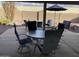 Patio furniture with umbrella and fire pit at 2705 S Copperwood --, Mesa, AZ 85209