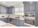 Modern kitchen with gray cabinets and quartz countertops at 2746 S Harmony Ave, Gilbert, AZ 85295