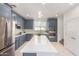 Modern kitchen with gray cabinets and island at 2746 S Harmony Ave, Gilbert, AZ 85295