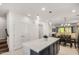 Modern kitchen island with white countertops and dark cabinets at 2746 S Harmony Ave, Gilbert, AZ 85295