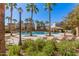 Inviting community pool area with palm trees and seating at 2746 S Harmony Ave, Gilbert, AZ 85295