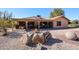 Landscaped backyard with covered patio and gravel at 2747 Leisure World --, Mesa, AZ 85206