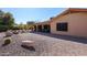 Backyard features a covered patio, gravel, and rock accents at 2747 Leisure World --, Mesa, AZ 85206