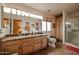 Bathroom with double vanity, shower, and granite countertop at 2747 Leisure World --, Mesa, AZ 85206