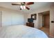 Primary bedroom with a king-size bed and double doors at 2747 Leisure World --, Mesa, AZ 85206