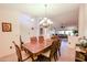 Formal dining room with chandelier and hardwood table at 2747 Leisure World --, Mesa, AZ 85206