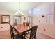 Formal dining room with chandelier and hardwood table at 2747 Leisure World --, Mesa, AZ 85206