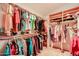 Spacious walk-in closet with custom shelving and rods at 2747 Leisure World --, Mesa, AZ 85206