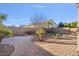 Landscaped backyard with a putting green and patio area at 28210 N Gedona Way, San Tan Valley, AZ 85143