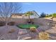 Putting green and landscaping in backyard at 28210 N Gedona Way, San Tan Valley, AZ 85143