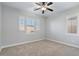 Bright bedroom featuring carpet and plantation shutters at 28210 N Gedona Way, San Tan Valley, AZ 85143