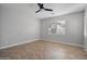 Spacious bedroom with herringbone floors and ceiling fan at 28210 N Gedona Way, San Tan Valley, AZ 85143