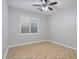 Bright bedroom with wood-look floors and plantation shutters at 28210 N Gedona Way, San Tan Valley, AZ 85143