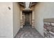 Front entry with a decorative metal door and stone accents at 28210 N Gedona Way, San Tan Valley, AZ 85143