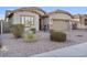 House exterior with a two-car garage and well-manicured landscaping at 28210 N Gedona Way, San Tan Valley, AZ 85143