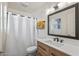 Modern bathroom with a vanity, shower, and large mirror at 2826 E Victor Hugo Ave, Phoenix, AZ 85032