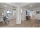 Modern dining room with a wooden table and white chairs, view of kitchen at 2826 E Victor Hugo Ave, Phoenix, AZ 85032