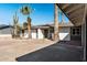 Side view of a remodeled mid-century modern home with a two-car garage at 2826 E Victor Hugo Ave, Phoenix, AZ 85032