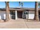 Front entrance of a renovated mid-century home with a unique door at 2826 E Victor Hugo Ave, Phoenix, AZ 85032