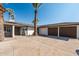 Modern home exterior with a two-car garage and landscaped yard at 2826 E Victor Hugo Ave, Phoenix, AZ 85032