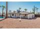 White brick home exterior with a spacious backyard and pool at 2826 E Victor Hugo Ave, Phoenix, AZ 85032