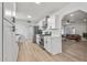 Modern kitchen with white shaker cabinets, quartz countertops, and stainless steel appliances at 2826 E Victor Hugo Ave, Phoenix, AZ 85032