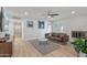 Living room features hardwood floors, a fireplace, and a brown leather couch at 2826 E Victor Hugo Ave, Phoenix, AZ 85032