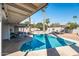 Relaxing kidney shaped pool with patio and lush landscaping at 2826 E Victor Hugo Ave, Phoenix, AZ 85032