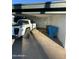 Covered carport with space for one vehicle and extra storage at 2835 N 49Th St, Phoenix, AZ 85008