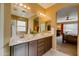 Double vanity bathroom with access to bedroom at 29711 N Yellow Bee Dr, San Tan Valley, AZ 85143