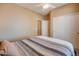 Comfortable bedroom with large closet and ceiling fan at 29711 N Yellow Bee Dr, San Tan Valley, AZ 85143