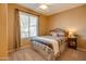 Cozy bedroom with striped bedding and ceiling fan at 29711 N Yellow Bee Dr, San Tan Valley, AZ 85143