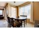 Casual dining area with round table and four chairs, near sliding glass door at 29711 N Yellow Bee Dr, San Tan Valley, AZ 85143