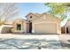 Tan two-car garage home with desert landscaping at 29711 N Yellow Bee Dr, San Tan Valley, AZ 85143