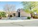 Single-story home with a two-car garage and desert landscaping at 29711 N Yellow Bee Dr, San Tan Valley, AZ 85143