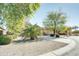 Two-story home with a large front yard and mature trees at 29711 N Yellow Bee Dr, San Tan Valley, AZ 85143